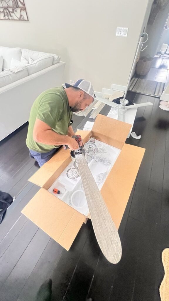 Ceiling fan installation Chicago — assembling a new ceiling fan before mounting