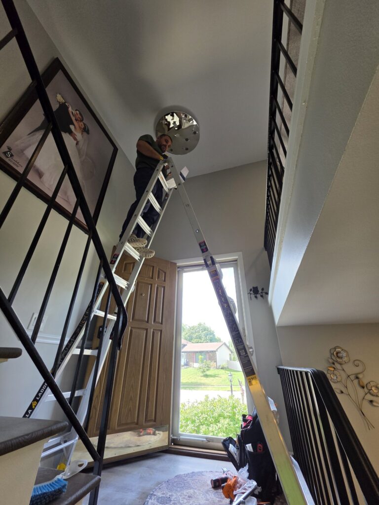 Chandelier installation Chicago — mounting a chandelier on a high ceiling