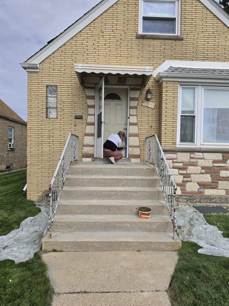 Porch steps painting Chicago — front door taped off and steps cleaned during prep