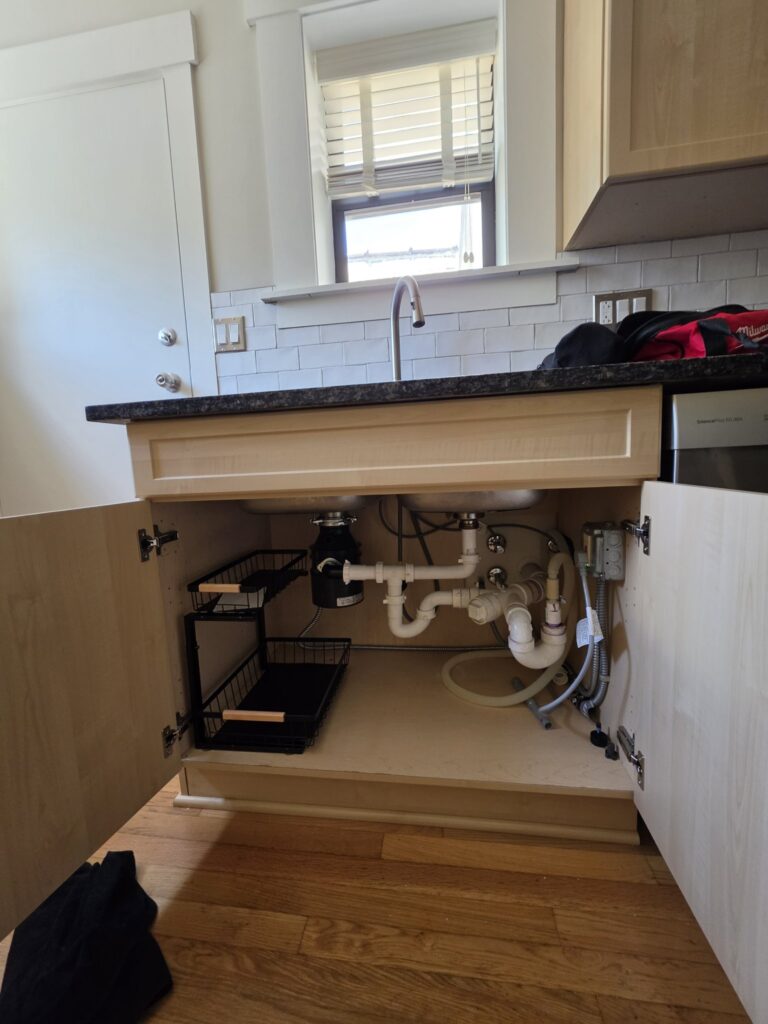 Installed garbage disposal Chicago — finished under-sink disposal and drain hookup
