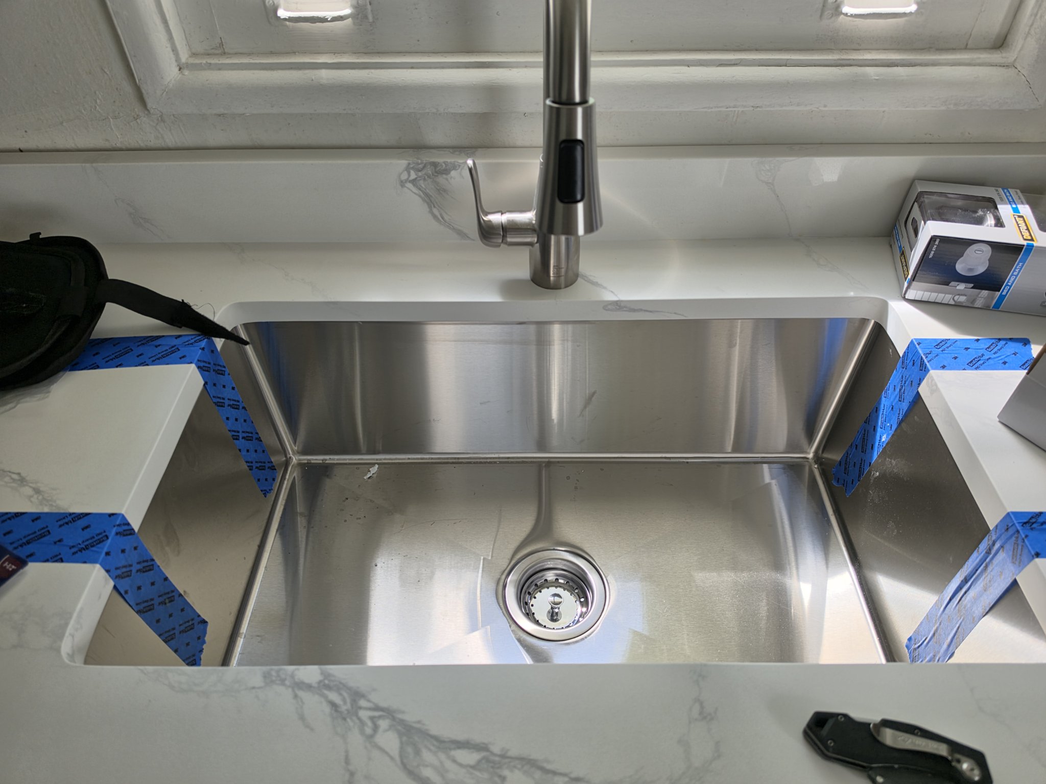Faucet installation Chicago — handyman installing a new kitchen sink and faucet