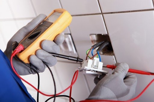 Outlet installation Chicago — testing an outlet with a multimeter