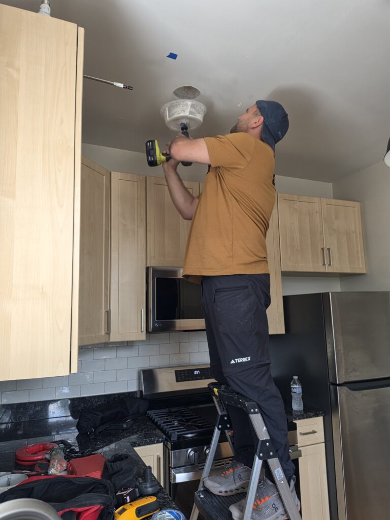 Recessed light installation Chicago — cutting a ceiling hole for a can light