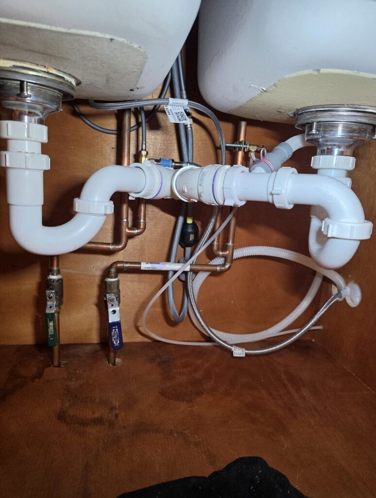 Dishwasher drain hookup Chicago — finished under-sink drain and water connections